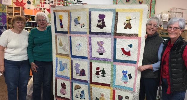 2017 Quaker Village Auction Quilts Sunbonnet Sue - 65 x 79 inches Faye Reed, Mary Reed, Billie Farley, Barb Irish This quilt was started in 2001 by the Sryinga Appliqué Group, a group of quilters who
