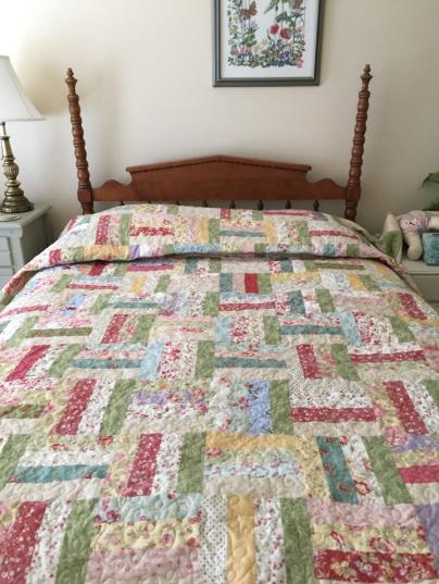 Springtime Softness - 93 x 110 inches This beautiful pastel quilt is 100% cotton with high quality fabric.