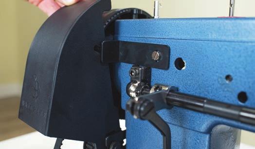 The protrusion of the L-shaped bracket (I) on the machine should fit snugly into a slot (J) on the belt cover (Figure