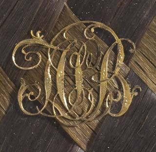 Figure. The initials JCSB in gold over plaited hair on reverse (detail).