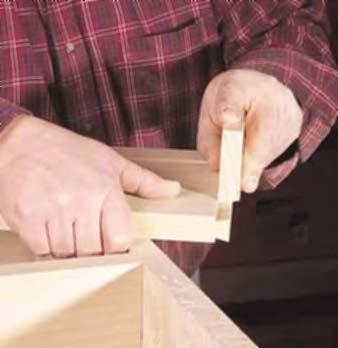The second piece of plywood keeps the jig square to the side. Chuck a 3 4" dovetail bit with a 14-degree slope into your router and set the router to cut 7 16" into the sides.