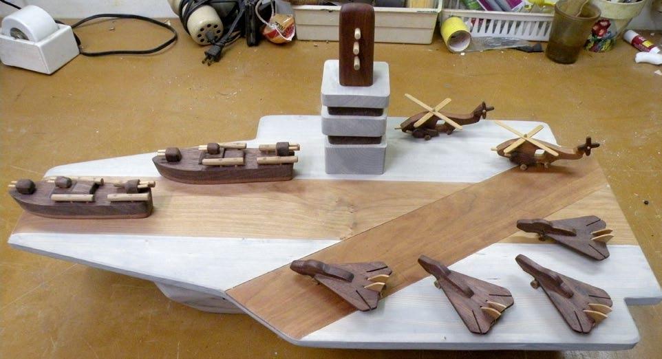 Stan Warmath uses a mix of hardwoods to create this dramatic Top Gun Aircraft