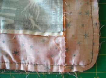 Stitch through all the layers, gently rounding the corners as you stitch, as shown here. Trim the rounded corners.