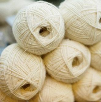 Skeins are relatively easy to knit from if you can keep them around a chair-back or your neck but most people find that hand-winding into balls makes life easier.