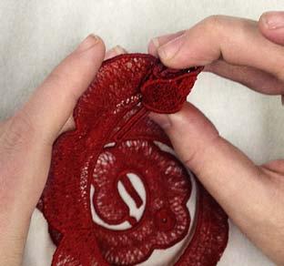 After the lace has dried use a chopstick, pencil or other thin, round item to begin wrapping the rose spiral.