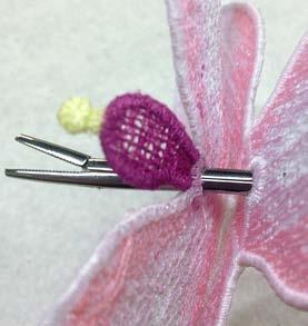 Attach the buttonette of the Orchid Middle Layer to the lower eyelet of the Orchid Petals.