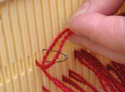 When a number of yarns are drawn through the heddle holes, tie them together. Continue threading and tying the rest of the yarns. Wire threader which comes with your loom.