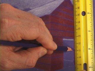 Now lay your ruler vertically against the little mark and next to