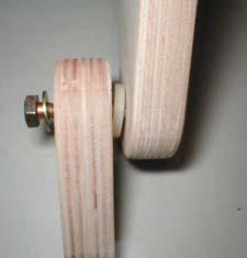 the front roller supports, matching slots and pre drilled holes. See Fig.