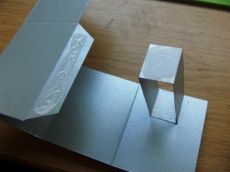 Step 19. Add a small amount of glue to the end tab & on the end of the just added rectangle box shape.