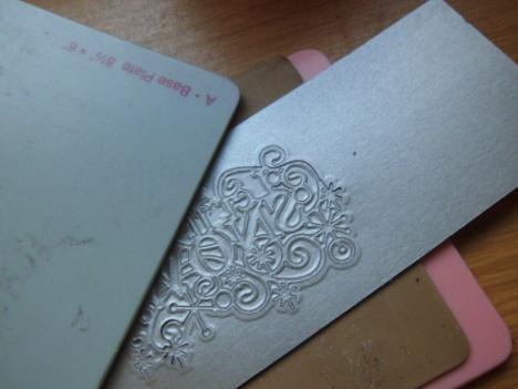 Step 22. Now use the pink plate, then the embossing tan mat, the die with the cut facing upwards into the card and cover with the base plate.