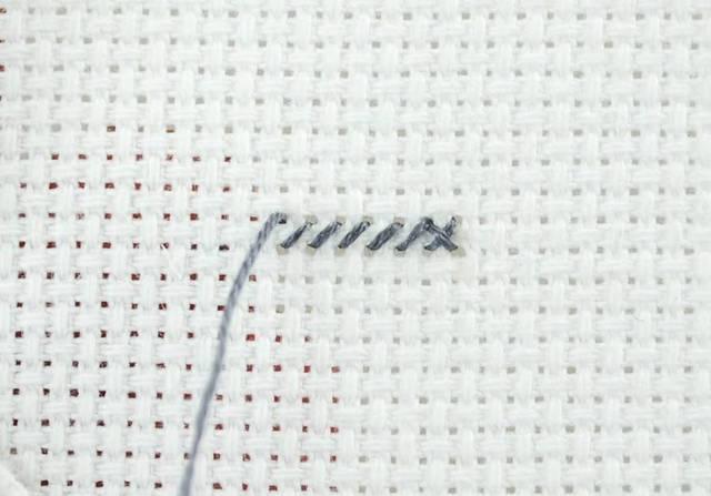 You can either make up row of stitches using single cross stitch (completing each stitch before beginning the next one), or you may make a row of bottom