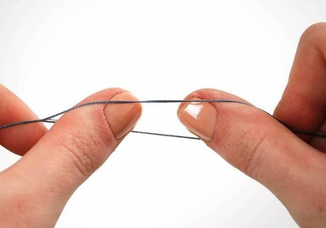 To separate strands, cut an arm s length of floss and hold with both hands at the midpoint.