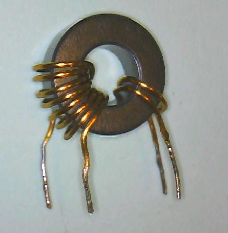 Take a 120 mm length of 0.4mm enamelled copper wire. Wind 4 turns on the ferrite toroid. This is winding 3.