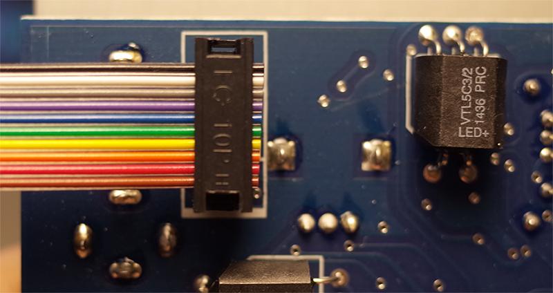 synthesizer case. If you have a bi-colored ribbon cable the red stripe should be on a same side with a bold white line on a pcb.
