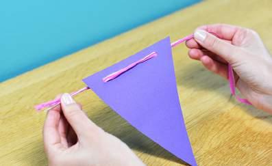 To copy as many pennants as needed, just trace the shape with a crayon onto