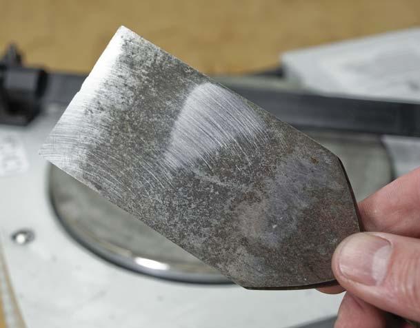 You need to hold the chisel steady so that your efforts on the abrasive are consistent unwaveringly parallel to the stone no rocking as you work the blade back and forth.