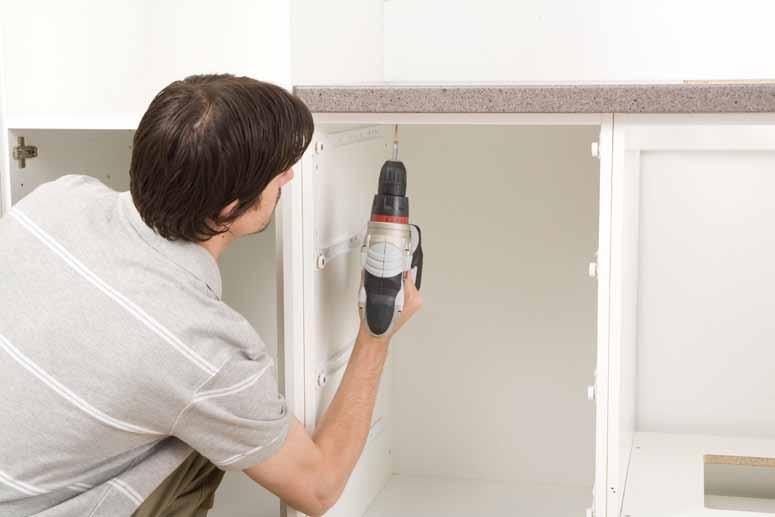 The benchtop can be secured with screws (use additional screws from your cabinet hardware pack), through the front and rear top rails of the base cabinets.