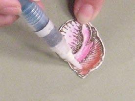6 13 Using a heat tool, melt the powder on the stamped shells to finish embossing the images. Stamp and emboss four more seashells.