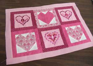 Prepare the fabric for the top and bottom borders by cutting two pieces of fabric 20 inches wide by 1 1/2 inches high.