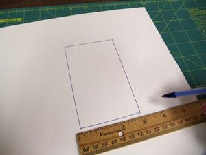 Next, we'll prepare the pattern piece for the heart blocks. Draw a 2 3/4 inch wide by 5 inch high rectangle on a piece of paper or tag board.
