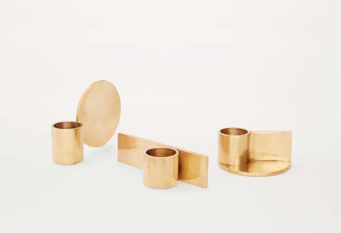 FUNDAMENT CANDLE HOLDERS Fundament is a series of three candlesticks that are made of solid brass. These candle holders are a study in geometry, proportion and composition.