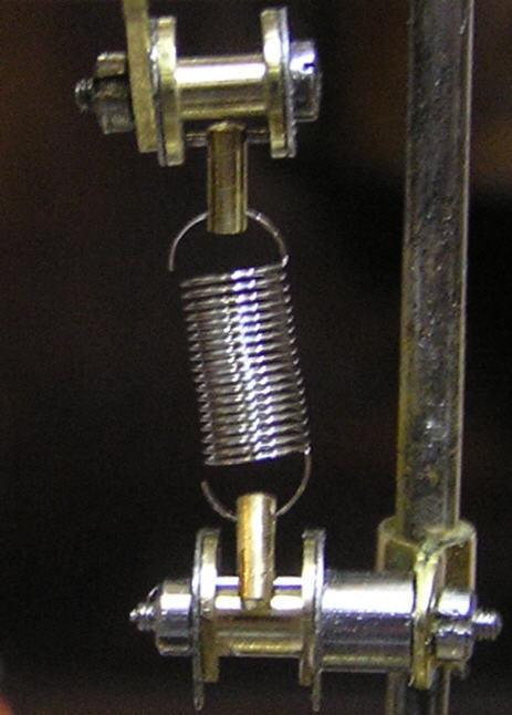 The photo above shows the Isochron spring in postion. It should be under no tension when at rest.