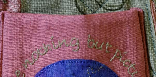 Embroidery 4. Using the Pigma pen, lightly trace the wording design printed on the pattern sheet of Homespun Vol 11 No 5 onto one of the 4½ x 5in pink homespun rectangles.