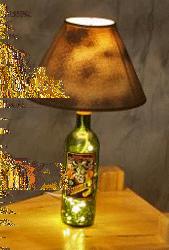 A bottle lamp kit allows you turn your bottle into a functional lamp that can be used in any room of your house. The one pictured here has both a set of white mini lights and the lamp kit in it.