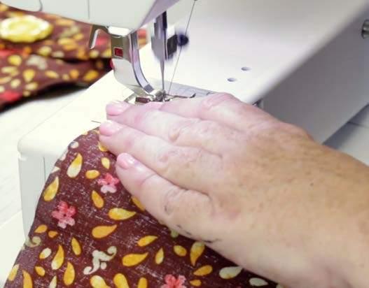 Pin your two pieces of fabric and the batting together, with the batting on the bottom and two pieces of fabric right