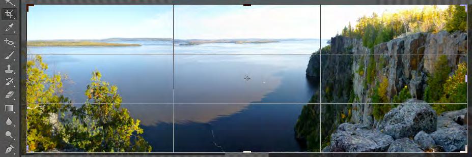 In the Tools panel, select the Crop tool and frame your panorama. A Rule of Thirds grid appears with sizing handles (Figure 5). Figure 5 Framing the final panorama 7.