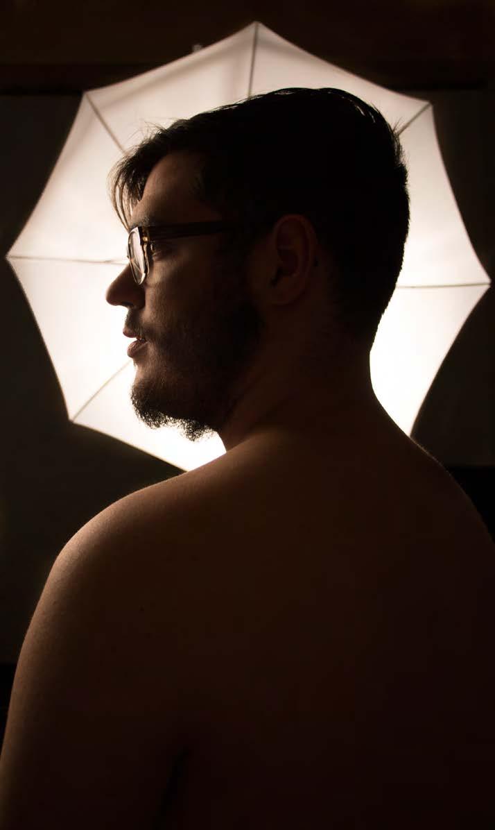 For this image I used two lights: an umbrella light in front of his face and one to the side. I think it is an effective set-up. I especially appreciate the way the light falls on his shoulder.