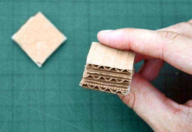 craft knife, cut five 2 x 2 inch squares of cardboard.