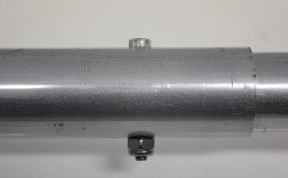 Note the joint in the picture below illustrating the counterbored (larger) hole in the outer tube to tightly nest the screw head.