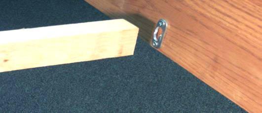 Place the slat with the red dot on the outside of the dowels at the head of the bed that were put in place in step #19.