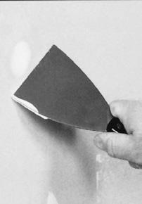 When sanding, be careful not to rough-up the fibers of the paper covering on the drywall. Remove the sanding dust with a damp sponge.