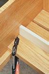 { A scrap of 1 / 2 "-thick stock can be used to space the slats evenly.