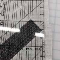 From the remainder of your Charcoal Maps fabric, cut ten 4.5 inch x WOF strips. Cut two strip in half. For each border, piece together 2 1/2 strips. Sew one onto each side, and trim to length.
