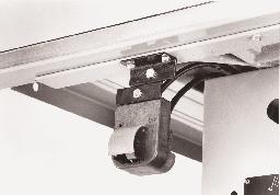 NOTE: If there is not enough cord (L) Figs. 21 and 22, available to pull out and reposition the switch, simply cut the cable strap holding the cord to the inside of the saw cabinet.