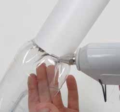 6. Pull each leg away from the inside of the tube and use white glue on the other side of the leg (Figure 10 on previous page). Push the leg firmly against the inside of the tube for a few seconds.