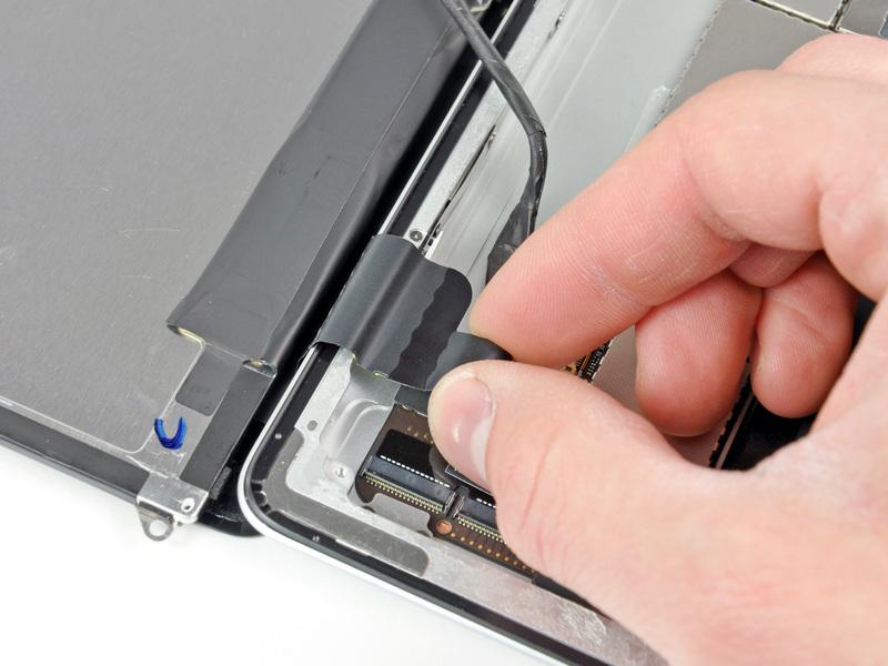 Carefully pull the digitizer cable off the adhesive securing it to the side of the