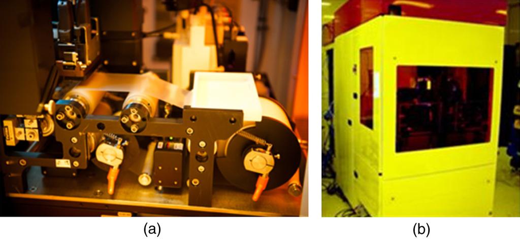 Fig. 2 (a) a partial view of LithoFlex100 being used for process development. (b) imprint tool is enclosed within an environment control unit. Fig. 3 SEM cross-sections of a silicon master.