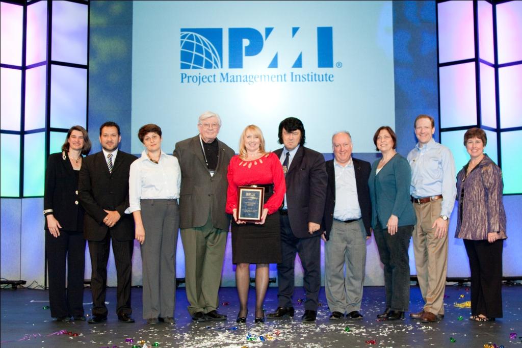 DECEMBER 2011 Volume 01, Issue 03 2011 PMI Annual Awards Ceremony. PMI members giving the 2011 Community of the Year Award to PMI Houston Chapter Board members.