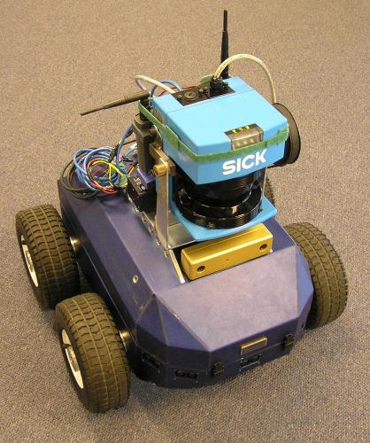 Figure 8: The robotic vehicle (an Applied AI GAIA) used for real-world training, with its SICK LMS-200 laser rangefinder and Point Grey Bumblebee digital stereo camera.