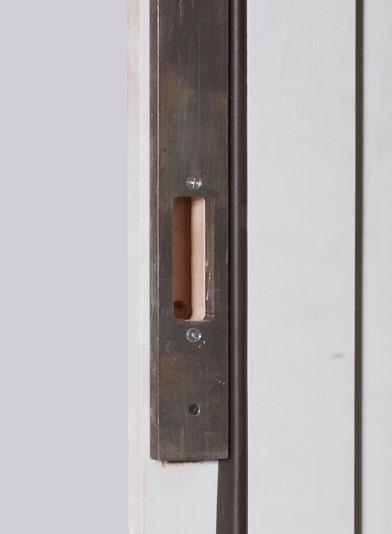 Now use the router to finish cutting the two rectangular holes into the doorframe using the doorframe router fixture as the guide. See Photo 5a and Photo 5b.