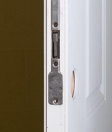 Secure Tru-Lock assembly into door panel using one # 8 x 1 1/4 screw in the bottom hole and five #