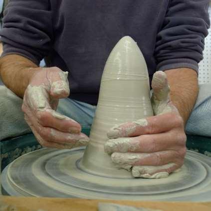 Coning When a mass of clay is worked on a potter s wheel, it is coned by repeatedly drawing it up into a conical shape and then