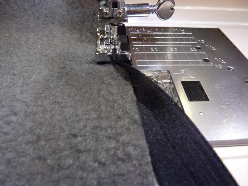 With the stretch of the FOE and the slight stretch to the fleece, we found it was easier to NOT pin the elastic in place.