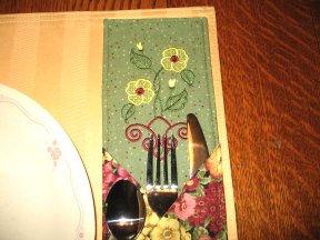 Center them vertically and approximately ½ in from the sides. Fuse pieces to placemat. 24.