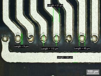 Photograph of an acceleration sensor with ASIC package, package top (left) and bottom (right) ASIC and sensor show a minimum contact pitch of 110 µm and